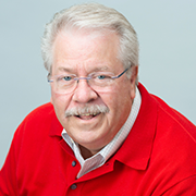 Man with glasses wearing a red shirt