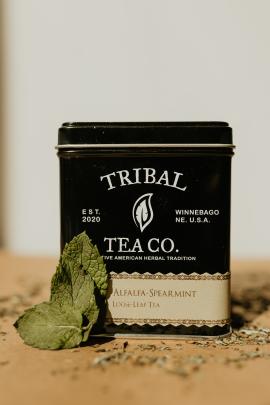 Tin of Tribal Tea Tea with a spearmint leaf