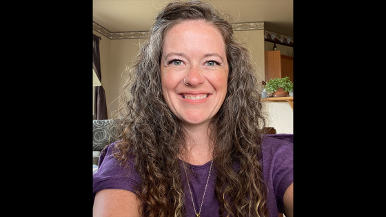 A picture of a woman with curly hair