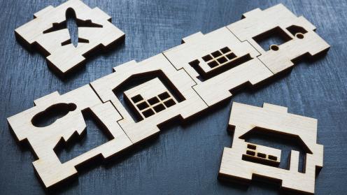 Wooden blocks with cutouts of icons of distribution transportation methods
