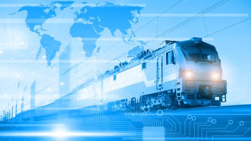 A freight train with an artistic blue overlay and world map overhead